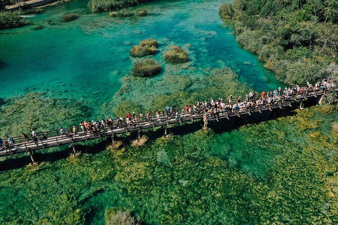 From Split: Krka Waterfalls Tour, Boat Cruise & Swimming - Inside Krka National Park: waterfalls, boardwalk loops, and crowd timing