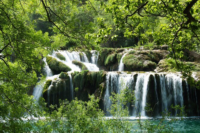 Krka Waterfalls Tour with Wine and Olive Oil Tasting - Krka National Park: 4 hours of waterfalls and bridge views