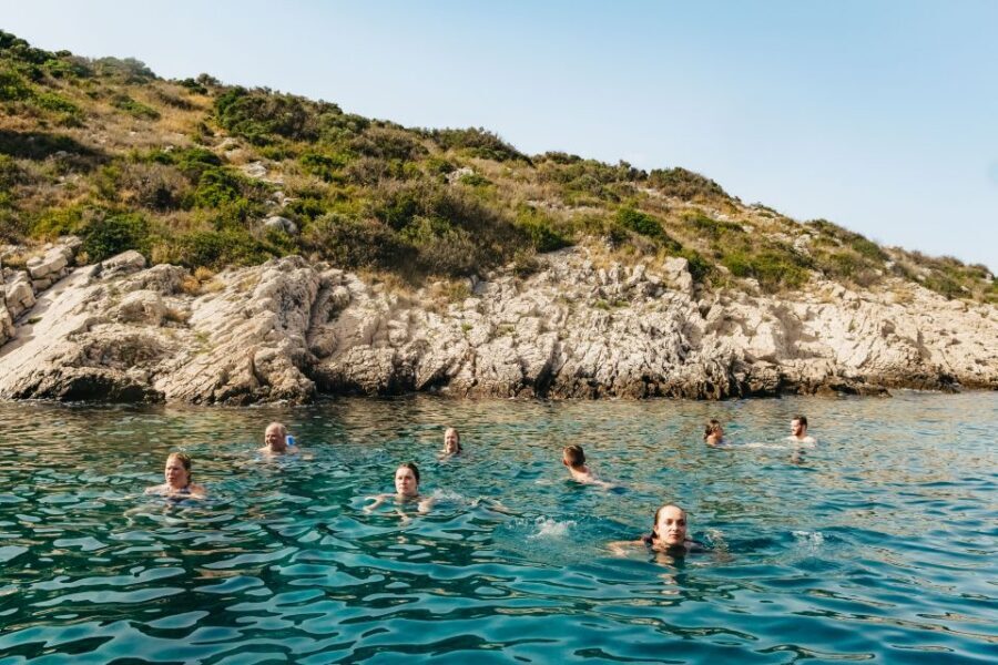Split: Hvar, Pakleni, Brač & Šolta All-inclusive Tour - The onboard vibe: clean catamaran, host energy, and dance-floor timing